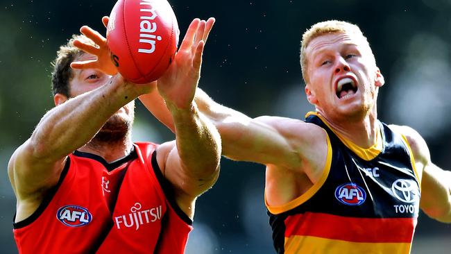 Essendon’s Tom Bellchambers competes against Reilly O'Brien. Picture: Mark Brake/Getty