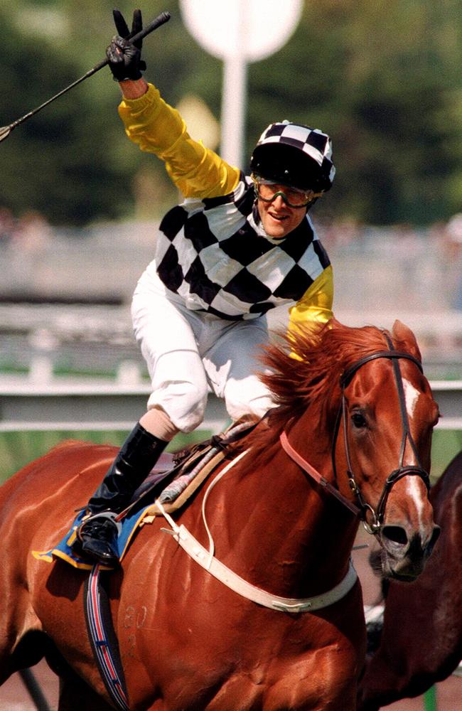 Darren Beadman salutes after winning the 1996 Melbourne Cup on Saintly. Picture: Andrew Tauber