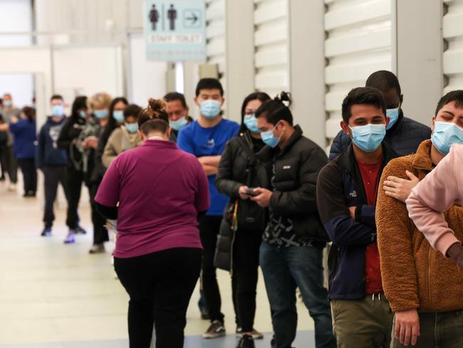 Aged care and disability care workers line up for their vaccine at the Melbourne Showgrounds. Picture: NCA NewsWire / Ian Currie