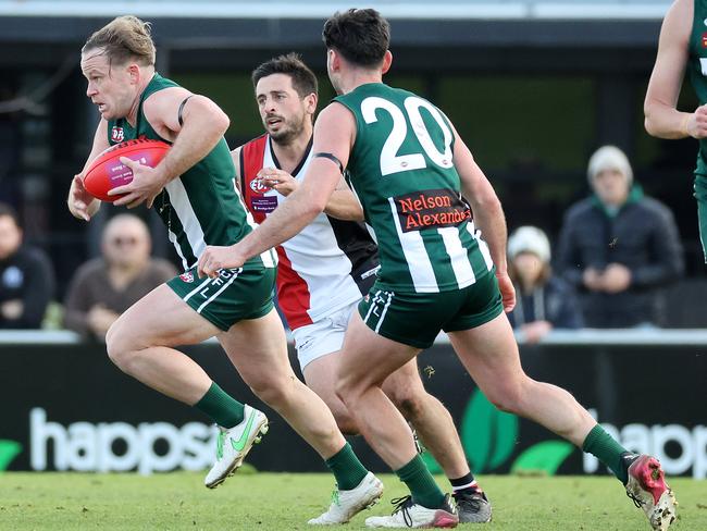 EDFL: Airport West’s Daniel Sinnott springs clear. Picture: George Salpigtidis