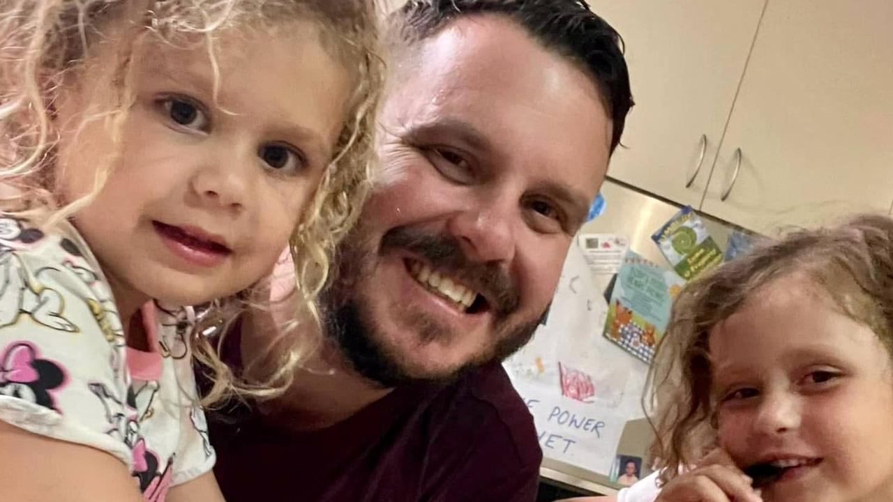 Phillip Thompson with daughters Emery and Astin.