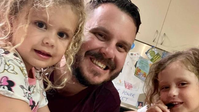 Phillip Thompson with daughters Emery and Astin.