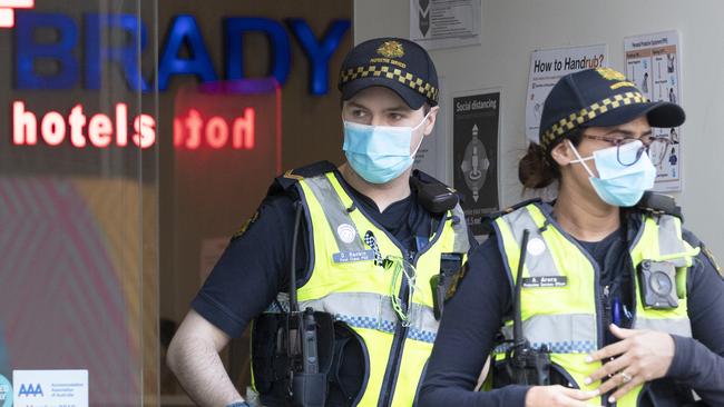 Protective service officers leave Melbourne’s Brady Hotel, which is being used as a quarantine centre. Picture: David Geraghty