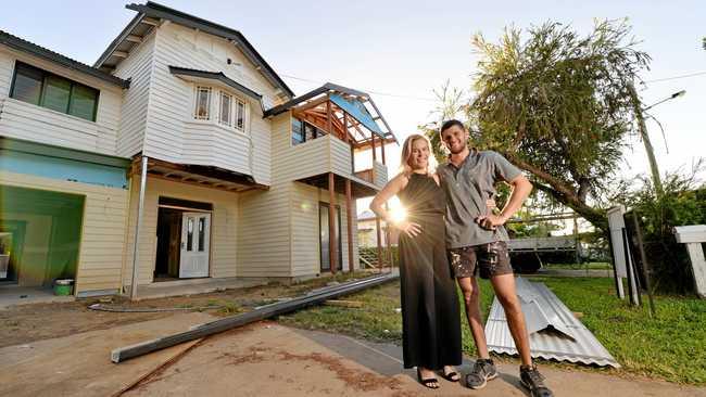 UNDER CONSTRUCTION: Mackay house-flippers Madison Strutynski and Michael Cotter at their Hunter St, West Mackay property. Picture: Stuart Quinn