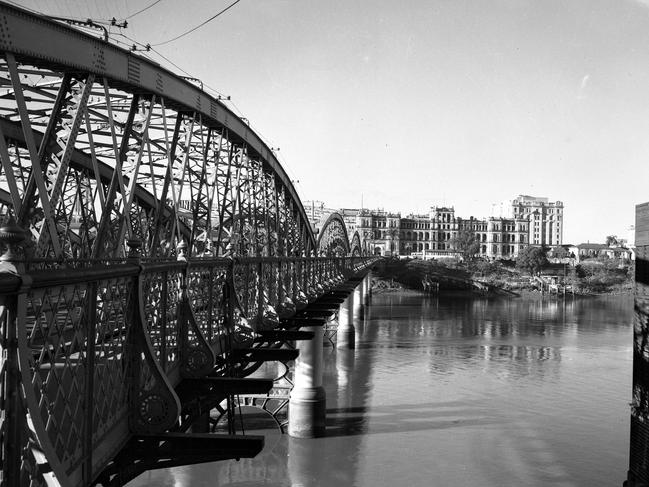 Victoria Bridge, looking north across the Brisbane River towards the Treasury Building on William, in 1948.