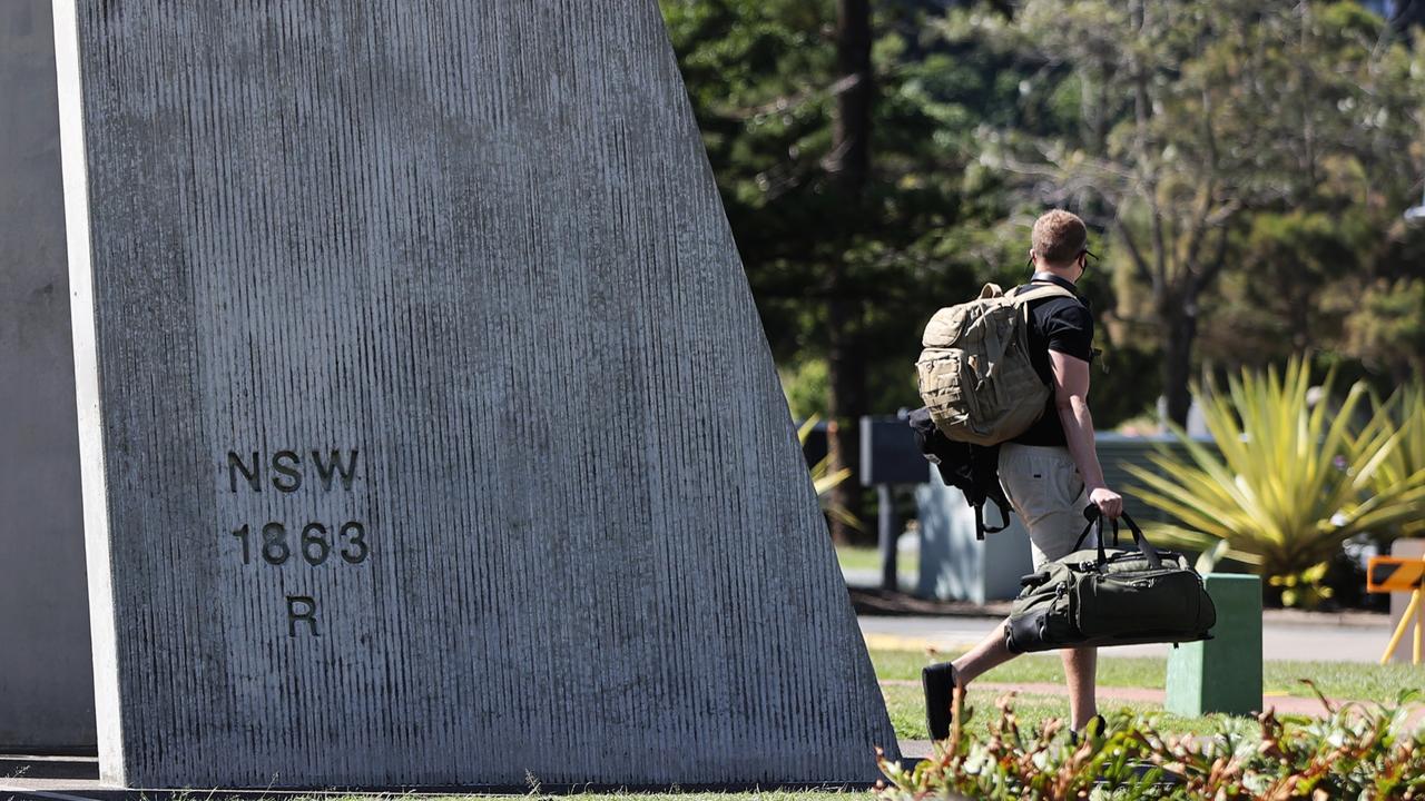 A traveller walks across the border from Griffith Street, Coolangatta.