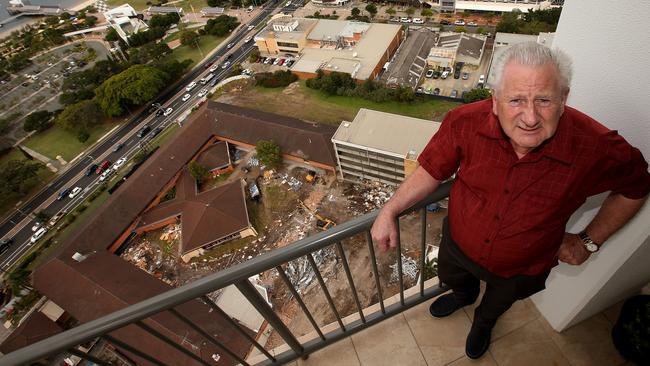 Southport resident Lindsay Jackson overlooking the Star of the Sea Convent which is being demolished from his high-rise apartment in the Nexus building. Picture by Scott Fletcher