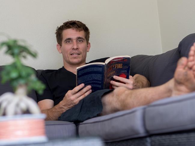 John Plant in the home he lives with his parents in the suburbs of Cairns. Picture: Marc McCormack