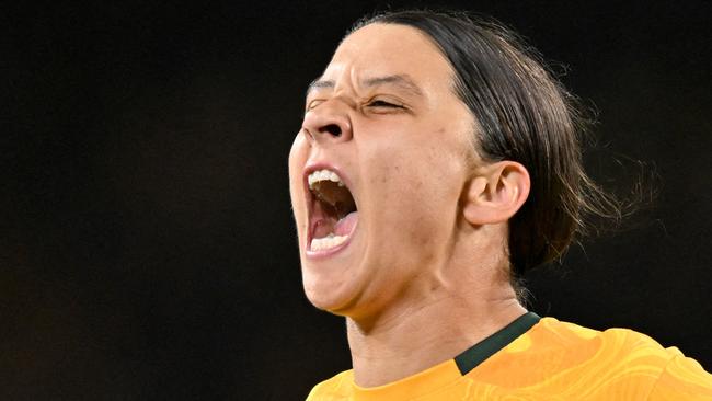 FILES-- This file photo taken on August 16, 2023 shows Australia's forward Sam Kerr celebrating scoring her team's first goal during the Australia and New Zealand 2023 Women's World Cup semi-final football match between Australia and England at Stadium Australia in Sydney. Chelsea and Australian women's football star Sam Kerr has been charged with a "racially aggravated offence" in Britain following a dispute involving a police officer, London's Metropolitan Police said March 4.  The 30-year-old striker, one of the highest profile and best-paid players in the women's game, was charged following an incident in London in January 2023, a police statement read. (Photo by IZHAR KHAN / AFP)