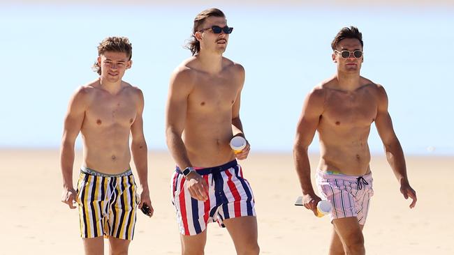 Sam Draper (centre) and teammates on the Gold Coast earlier in the month. Picture: Michael Klein