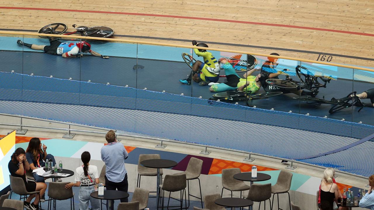 Riders lie on the track following the massive crash in the points race. Picture: Adrian Dennis/AFP