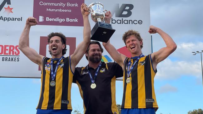 Hampton co-captains Leo Grenville and Corey Smith and coach Shannon Grant celebrate the SFNL Division 4 premiership victory. Picture: Valeriu Campan