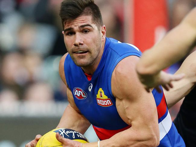 AFL Round 17. 14/07/2018. Melbourne vs Western Bulldogs at the MCG.  Western Bulldogs Marcus Adams cleans up deep in defence    . Pic: Michael Klein