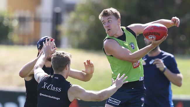 Western Bulldogs training at Whitten Oval. 25/02/2019. Jack Macrae handballs over the top . Pic: Michael Klein