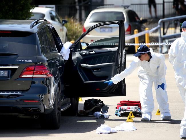 Forensics officers examine the vehicle. Picture: Toby Zerna