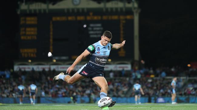 Nathan Cleary kicking in front of the famous scoreboard. Picture: Brett Costello