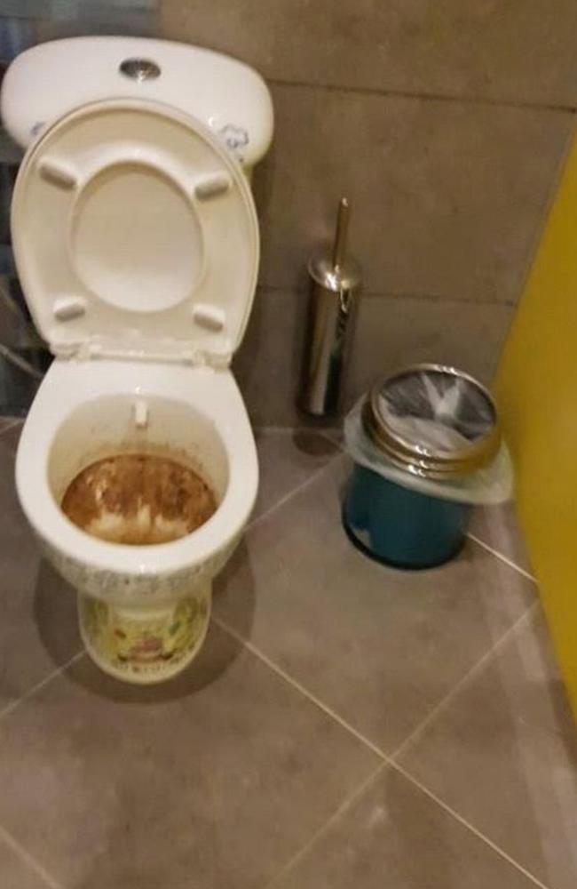 A nightmare situation in the bathroom, where the family found a puddle of water on the floor and water leaking from the light switch. Picture: SWNS/Mega