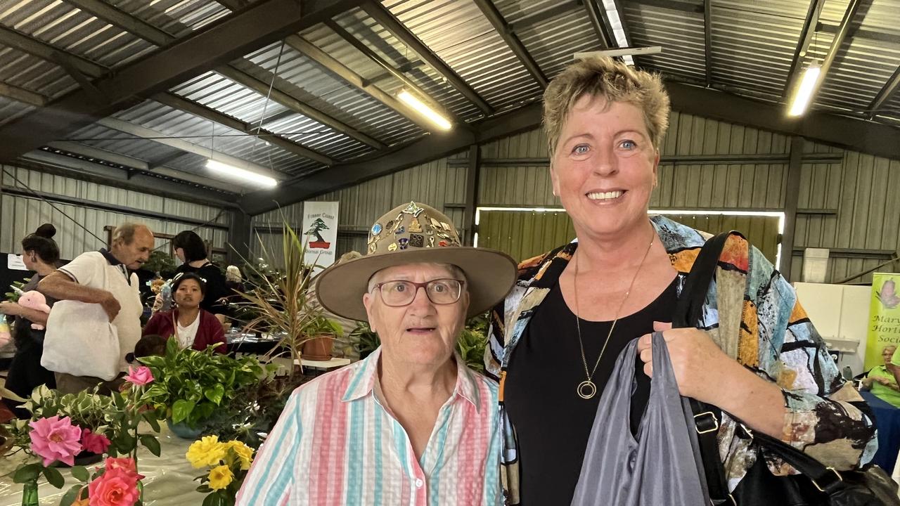 Kathleen O'Donnell and Saskia Noffke looking at the floral displays at the Fraser Coast Show.
