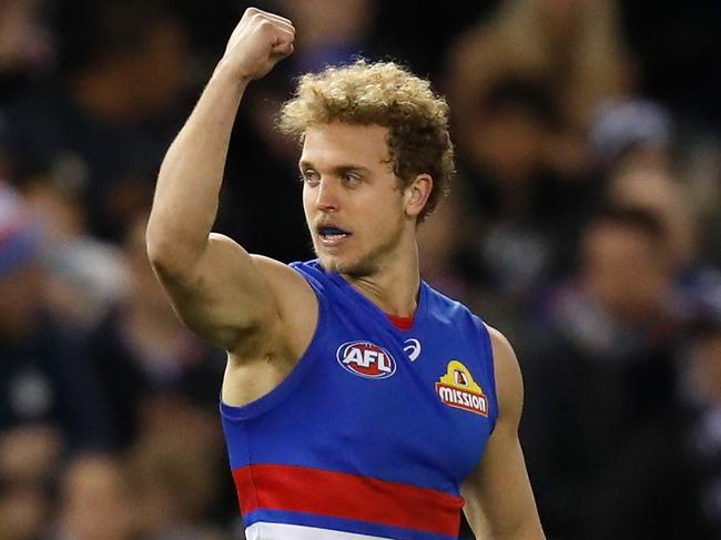 MELBOURNE, AUSTRALIA - AUGUST 19: Mitch Wallis of the Bulldogs celebrates a goal during the 2018 AFL round 22 match between the Carlton Blues and the Western Bulldogs at Etihad Stadium on August 19, 2018 in Melbourne, Australia. (Photo by Michael Willson/AFL Media/Getty Images)