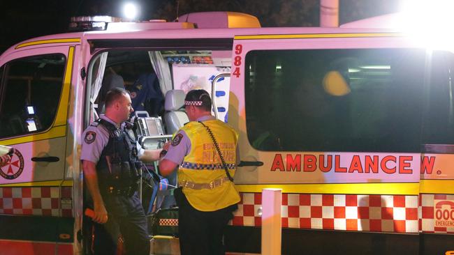 Generic Ambulance images. NSW Ambulance vehicles and Paramedics. Ambulance officers attend the scene of a crash at Qantas Drive, Mascot. Pics Bill Hearne