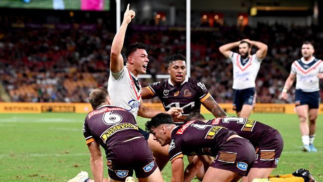 BRISBANE, AUSTRALIA – APRIL 08: Joseph Manu of the Roosters celebrates scoring a try during the round five NRL match between the Brisbane Broncos and the Sydney Roosters at Suncorp Stadium, on April 08, 2022, in Brisbane, Australia. (Photo by Bradley Kanaris/Getty Images)