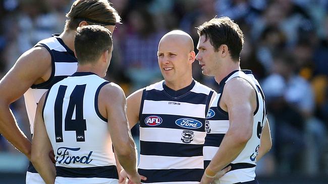 Joel Selwood, Patrick Dangerfield and Gary Ablett discuss tactics in the middle. Picture: Michael Klein