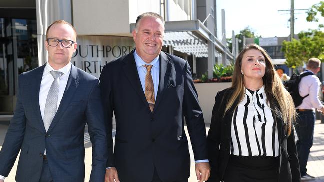 Former Queensland Police officer Rick Flori (centre) leaves the Southport Magistrates Court on the Gold Coast with social justice advocate Renee Eaves (right) and lawyer Kris Jahnke. Picture: AAP Image/Dave Hunt