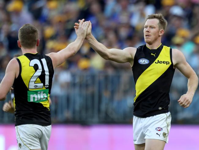 Jack Riewoldt (right) of the Tigers is congratulated by Jacob Townsend during the Round 9 AFL match between the West Coast Eagles and the Richmond Tigers at Optus Stadium in Perth, Sunday, May 20, 2018. (AAP Image/Richard Wainwright) NO ARCHIVING, EDITORIAL USE ONLY