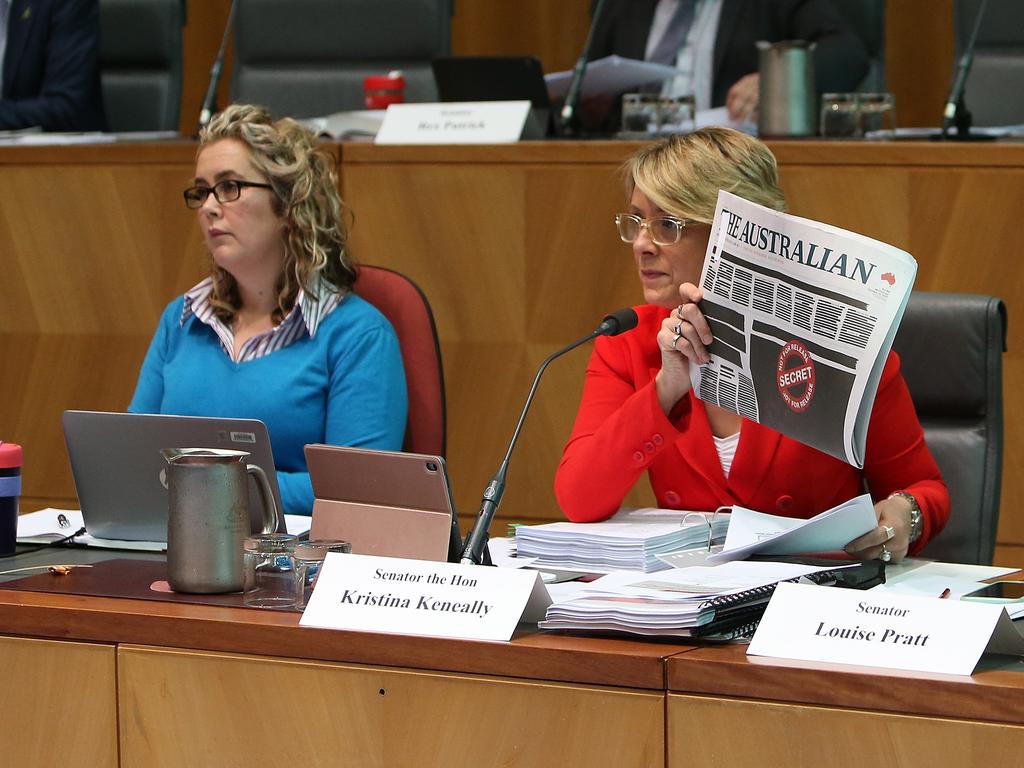 Kristina Keneally holding up the front pages of the papers as she asks questions at a Senate Estimates hearing on Legal and Constitutional Affairs at Parliament House in Canberra. Picture Kym Smith