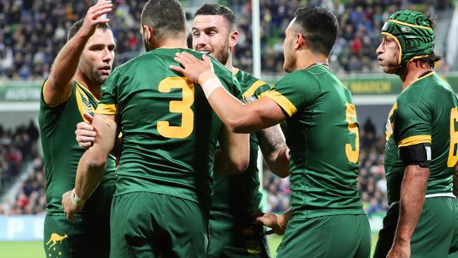 The Kangaroos celebrate after Greg Inglis scores a try against New Zealand.