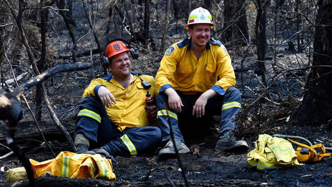 RFS firefighters Dave Theodorou (left) and Craig Salthouse take a break for Christmas lunch during an effort to clear containment lines in bushland between Mountain Lagoon and Bilpin. Picture: Sam Mooy/The Australian Newspaper