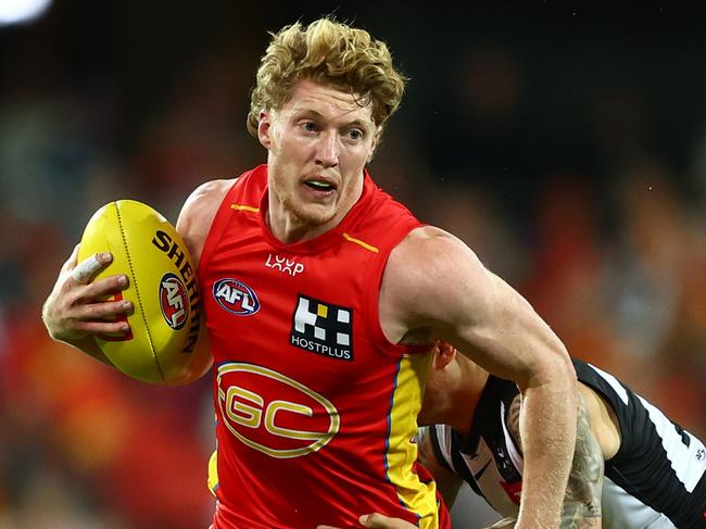 GOLD COAST, AUSTRALIA - JUNE 29: Matt Rowell of the Suns is tackled during the round 16 AFL match between Gold Coast Suns and Collingwood Magpies at People First Stadium, on June 29, 2024, in Gold Coast, Australia. (Photo by Chris Hyde/Getty Images)