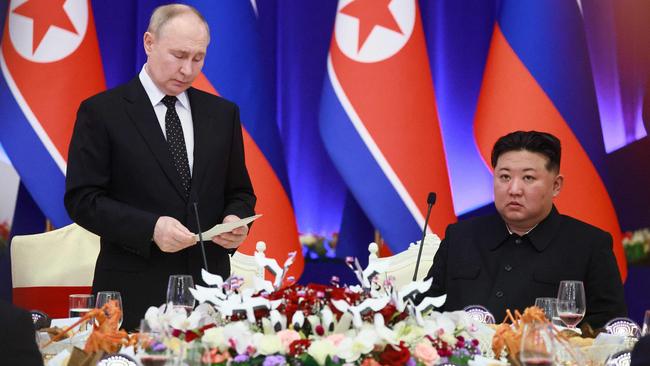 Russian President Vladimir Putin speaks as North Korean leader Kim Jong Un listen during a reception at the Mongnangwan Reception House in Pyongyang in June. Picture: Vladimir Smirnov/Pool/AFP