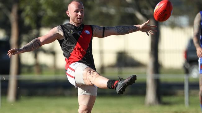 Braybrook’s Brad Busuttil boots his team forward. Picture: Local Legends Photography