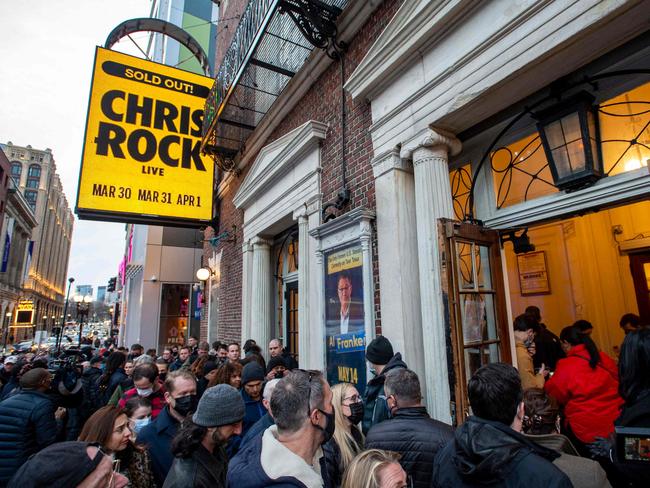 People wait in line to enter the Wilbur Theatre for a sold out performance by US comedian Chris Rock in Boston. Picture: AFP