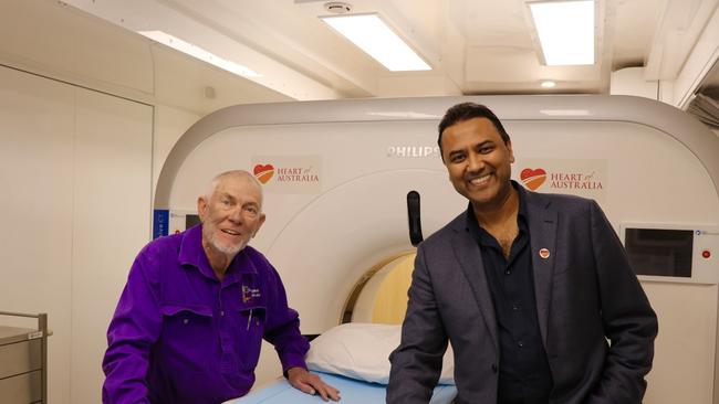 Photo of Dr Rolf Gomes and Gary Briggs in the truck. Picture: Supplied