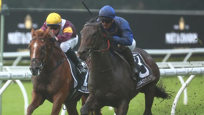 Broadsiding and James McDonald (outside) get the better of Linebacker to win the Group 1 Champagne Stakes at Randwick. Picture: Getty Images