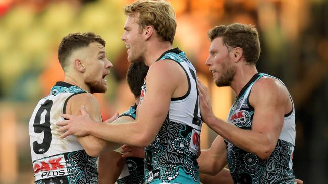 Port Adelaide players, led by Robbie Gray, tried to fight against the Hawks. Picture: AAP Images