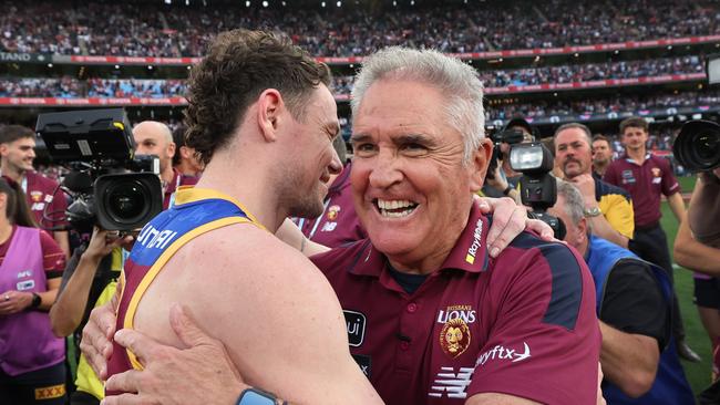 Co-captain Lachie Neale (left) and coach Chris Fagan celebrate Brisbane’s premiership win. Picture: David Caird