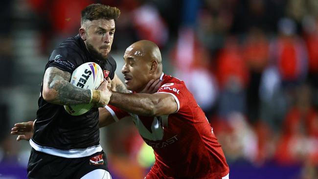 Felise Kaufusi, right, of Tonga tries to tackle a Wales player during the Rugby League World Cup. Kaufusi is one of the best players to come from the Rum City. Photo by Michael Steele/Getty Images