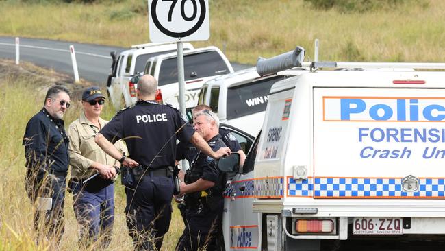 Police and ATSB investigators at the scene of the crash near Cedarton, Queensland. Picture Lachie Millard