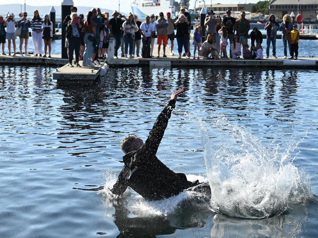 Christian Beck, skipper of LawConnect, is tossed by the crew into the water at Constitution Dock after winning line honours to last years Sydney-Hobart, on December 28, 2023 in Hobart, Australia. Picture: Steve Bell/Getty Images