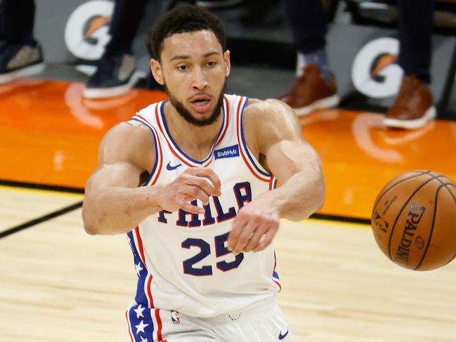 (FILES) In this file photo taken on February 13, 2021, Ben Simmons of the Philadelphia 76ers passes the ball during the first half of the NBA game against the Phoenix Suns at Phoenix Suns Arena in Phoenix, Arizona. NOTE TO USER: User expressly acknowledges and agrees that, by downloading and or using this photograph, User is consenting to the terms and conditions of the Getty Images License Agreement.   Christian Petersen/Getty Images/AFP - Simmons was hit with a one-game suspension by the team on October 19, 2021, ruling him out of the club's season opener against New Orleans. A Sixers statement said Simmons would miss the October 20 game against the Pelicans for "conduct detrimental to the team." US media reports said Simmons was suspended shortly after a bust-up with Sixers coach Doc Rivers, which ended with the Australian point guard being tossed from practice. (Photo by Christian Petersen / GETTY IMAGES NORTH AMERICA / AFP)