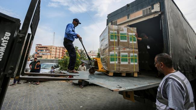 Medical aid is unloaded at Nasser Medical Hospital in Khan Yunis. Picture: Getty UImages