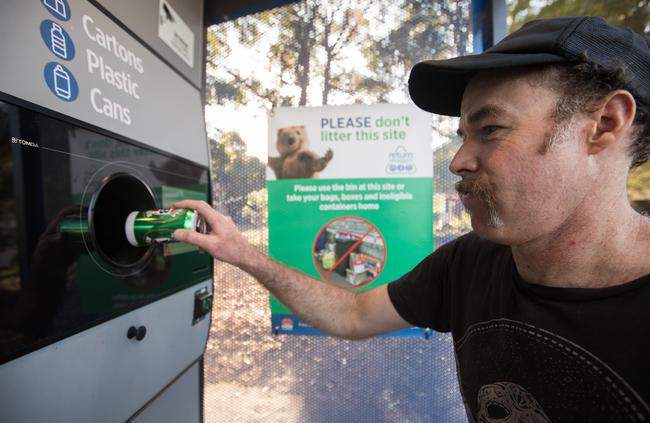 Tony Johns using the Addison Rd Community Centre machine to offset the rising cost of beer Picture: AAP Image / Julian Andrews