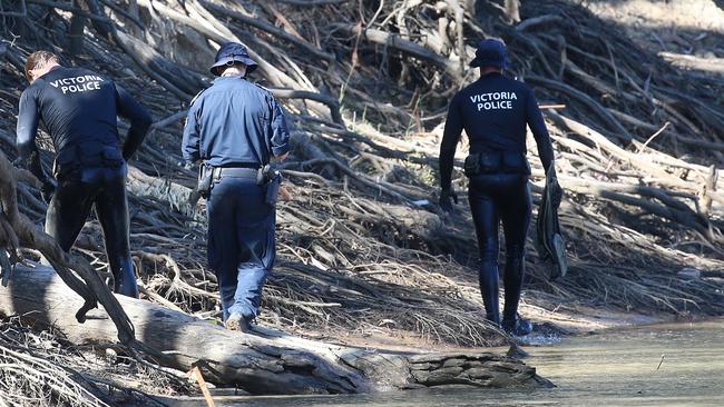 Victorian police divers search the Murray River for a missing boy in Moama, New South Wales, Australia. Picture: Hamish Blair