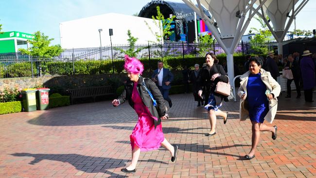 Some eager racegoers arriving during 2022 Lexus Melbourne Cup Day at Flemington Racecourse. Photo by Vince Caligiuri/Getty Images