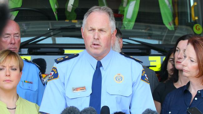 Tilyard holds a press conference during the 2013 bushfires, with then Prime Minister Julia Gillard on his right. Picture: NewsCorp