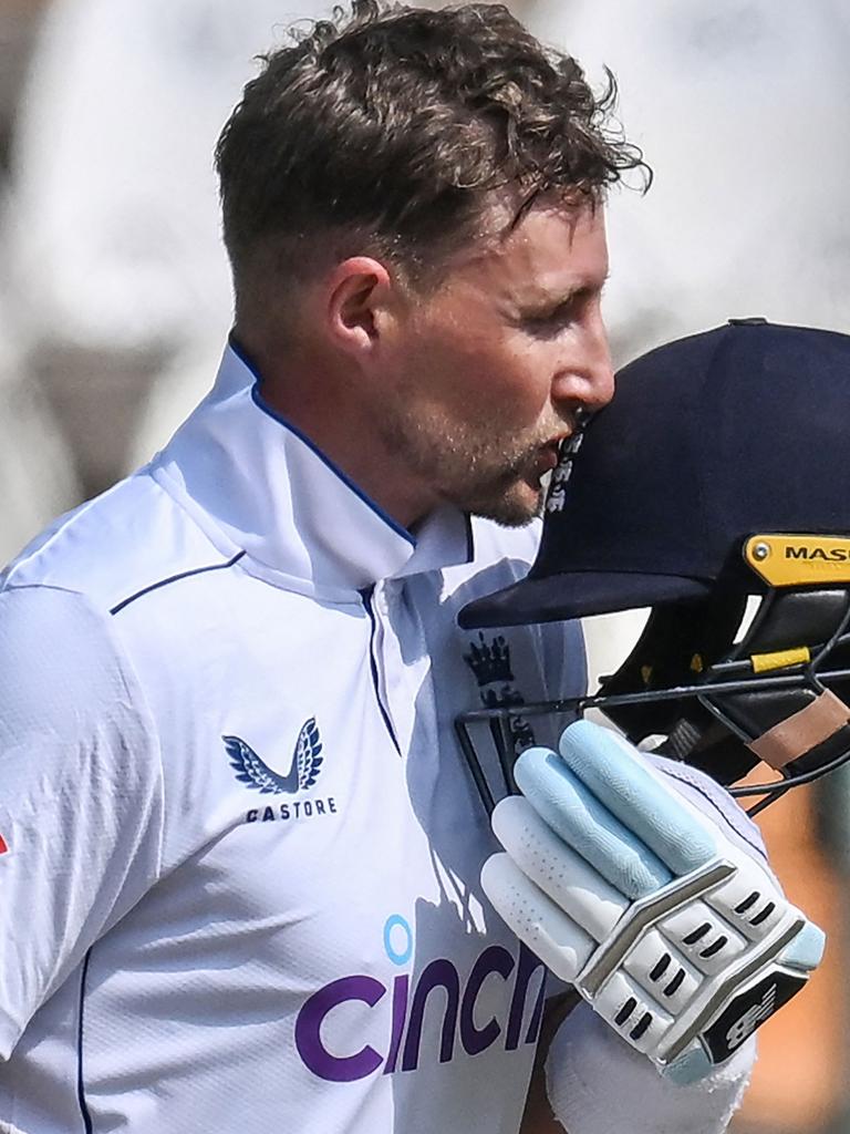 Joe Root celebrates after reaching 200. (Photo by Aamir QURESHI / AFP)