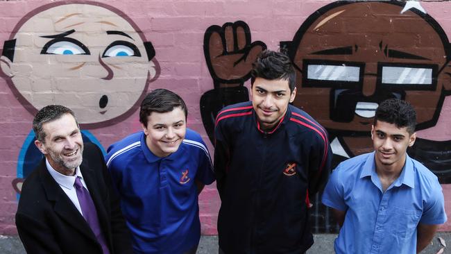 Principal Mike Saxon with students Sebastian Zappulla, Omar Fattal and Saifullah Naadeem at Liverpool Boys High School. Picture: Carmela Roche